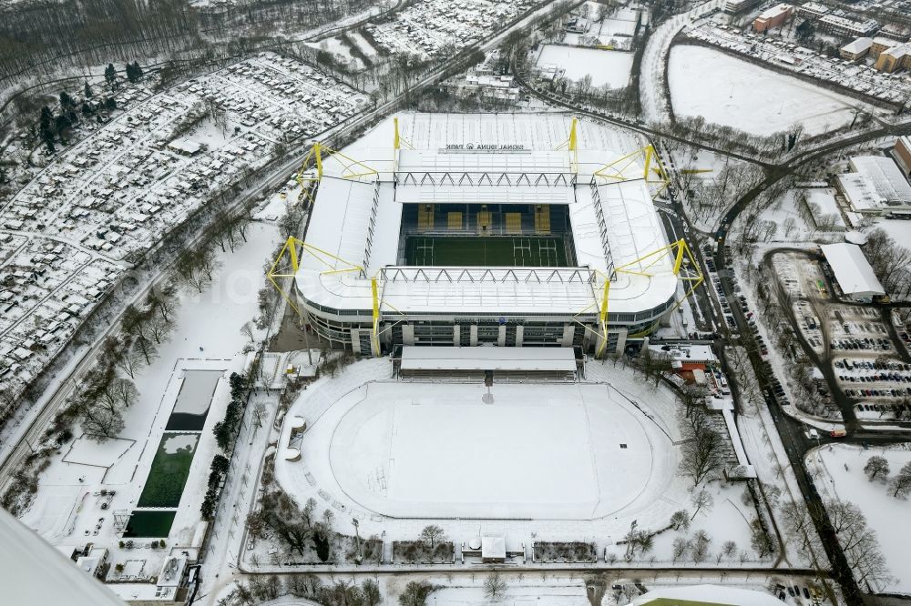 Dortmund from the bird's eye view: Winter - Aerial view of snow-covered terrain of Borusseum, the Signal Iduna Park stadium in Dortmund BVB in North Rhine-Westphalia