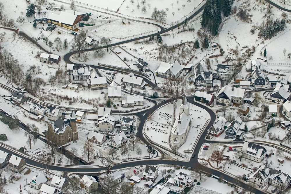 Aerial photograph Olsberg - Winter - Local view of snow-covered city on the Bruns Kappeler church and the castle Wildenberg Olsberg Sauerland in North Rhine-Westphalia NRW