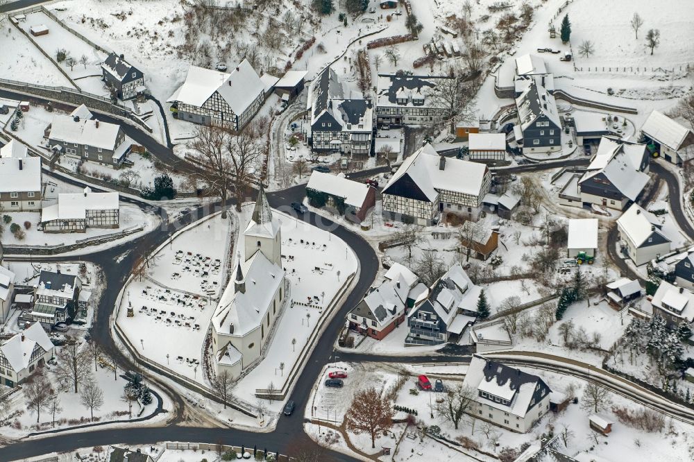 Olsberg from above - Winter - Local view of snow-covered city on the Bruns Kappeler church and the castle Wildenberg Olsberg Sauerland in North Rhine-Westphalia NRW