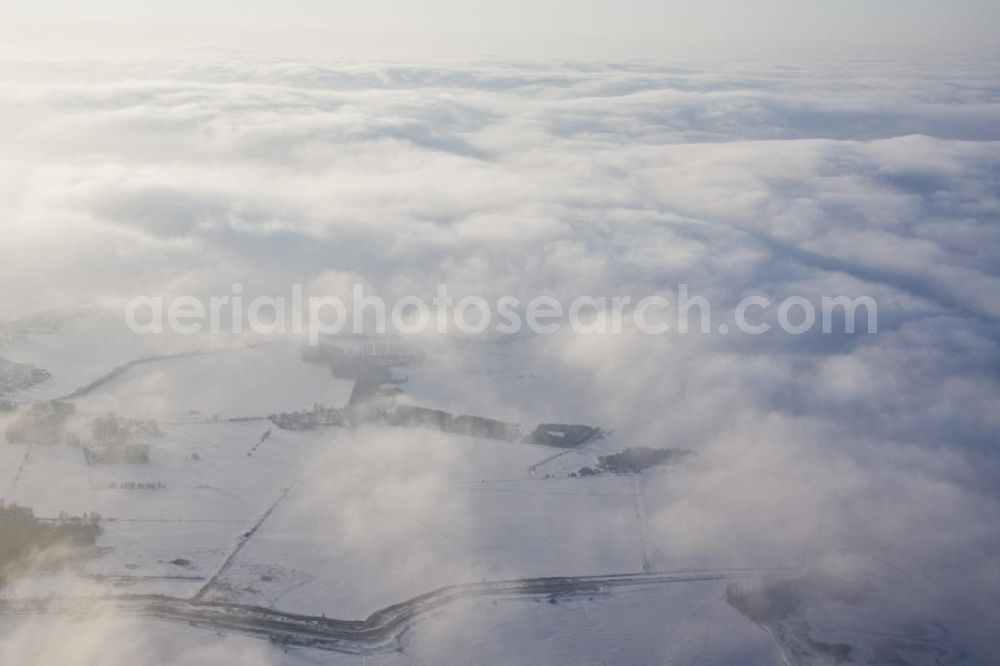 Aerial photograph Tutow - Winterlandschaft in Mecklenburg-Vorpommern in der Abendsonne.