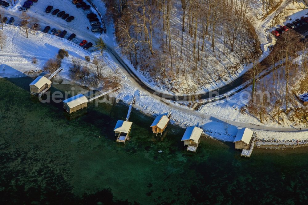 Kochel from the bird's eye view: Winter landscape with boat houses on the banks of the Loisach in Kochel am See in Bavaria