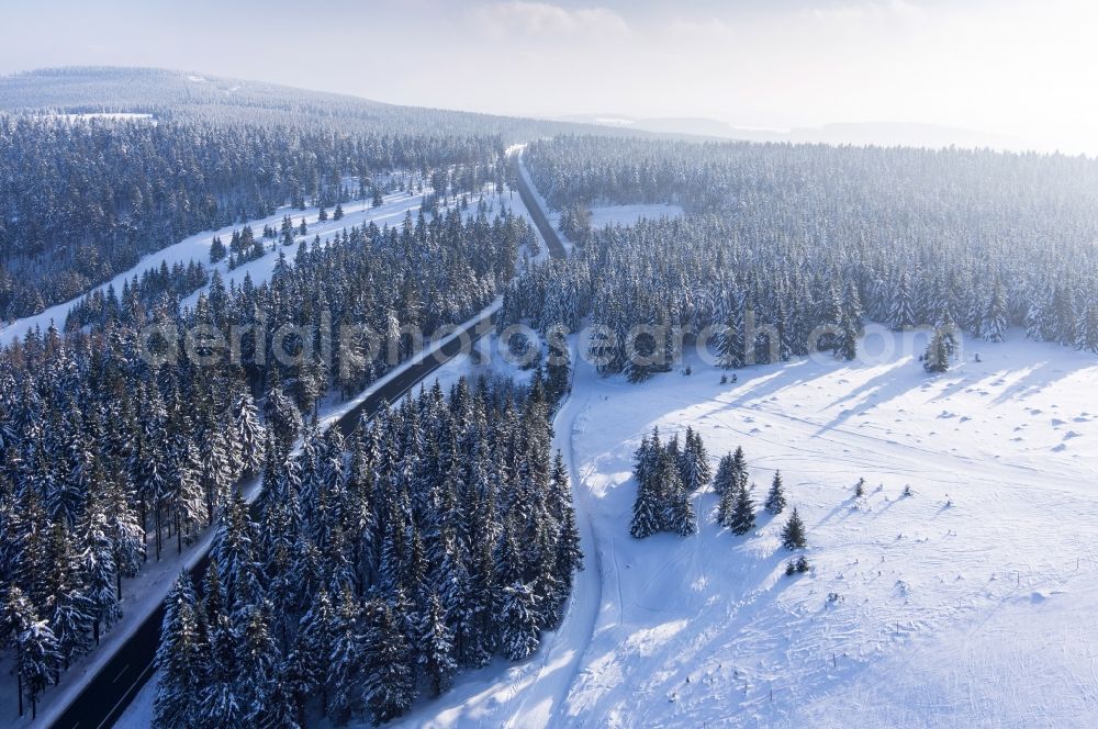 Harz from above - Snowy forest landscape along the Landstrasse 519 L519 in the Harz National Park in the state of Lower Saxony