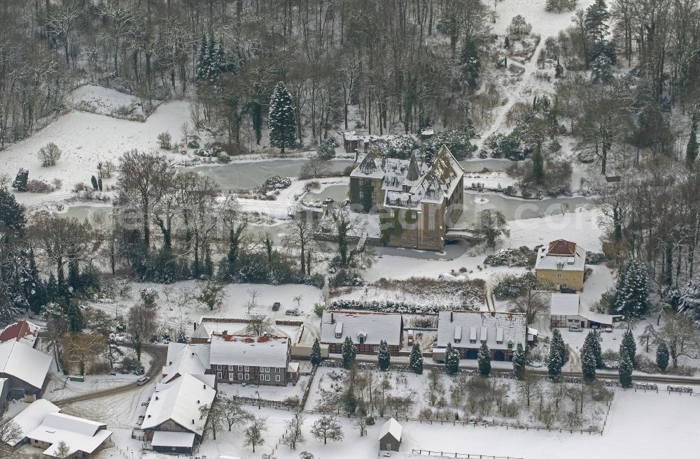 Arnsberg OT Voßwinkel from above - Winter landscape of snow-covered castle Höllinghofen in the Arnsberg district Voßwinkel in North Rhine-Westphalia