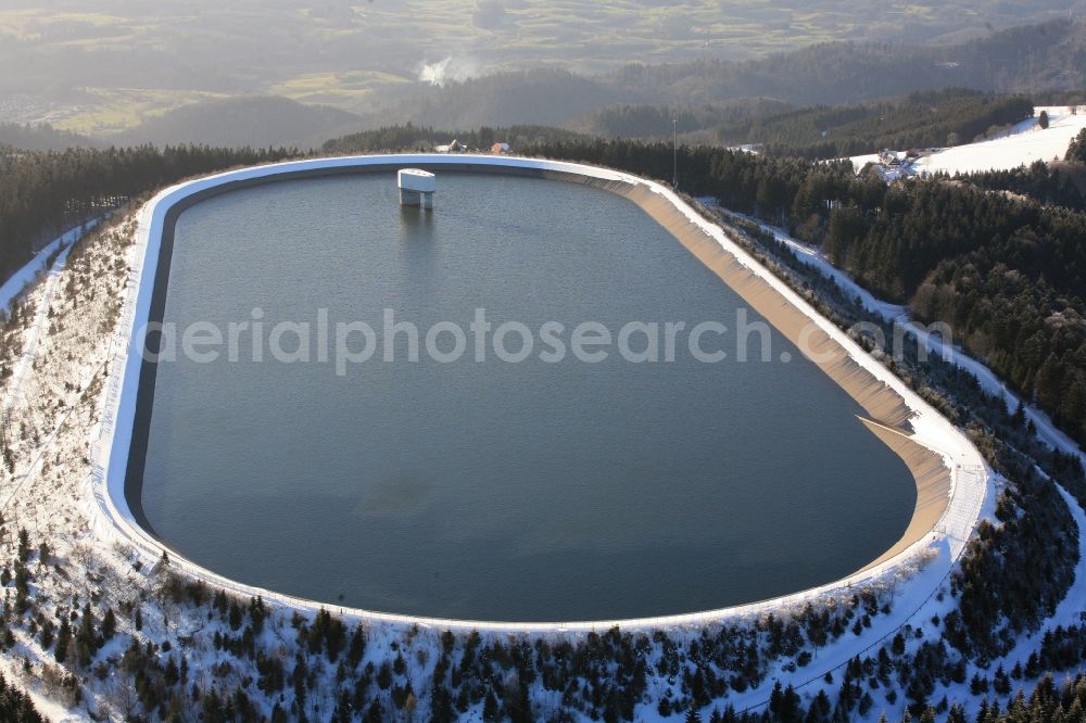 Herrischried from the bird's eye view: In winter snowy landscape on the Hotzenwald in Herrischried in the state of Baden-Wuerttemberg, the Hornbergbecken is the high reservoir of the pumped storage hydro power station of the Schluchseewerk AG