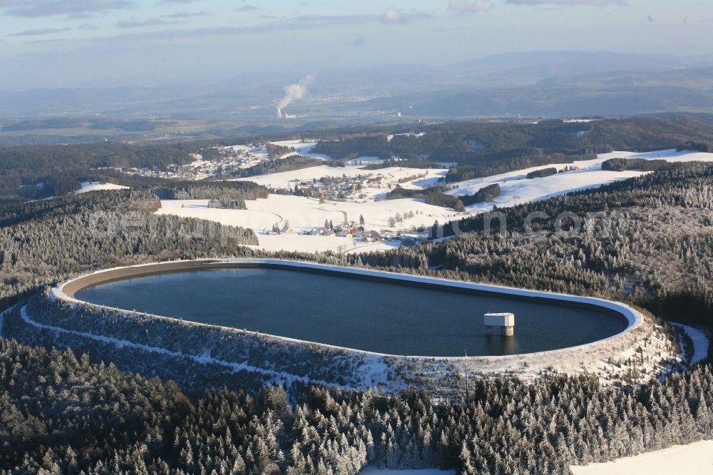 Herrischried from the bird's eye view: In winter snowy landscape on the Hotzenwald in Herrischried in the state of Baden-Wuerttemberg, the Hornbergbecken is the high reservoir of the pumped storage hydro power station of the Schluchseewerk AG