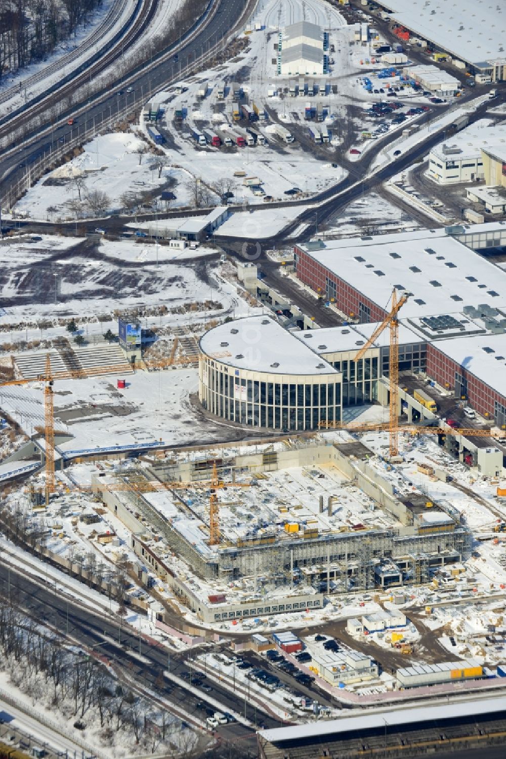 Aerial photograph Berlin - View of construction site at the exhibition venue Cube City Exhibition Grounds in Berlin Charlottenburg. On the site of the demolished Germany Hall is to be completed by the end of 2013, designed by the architectural firm UNIQUE CODE suitable congress hall