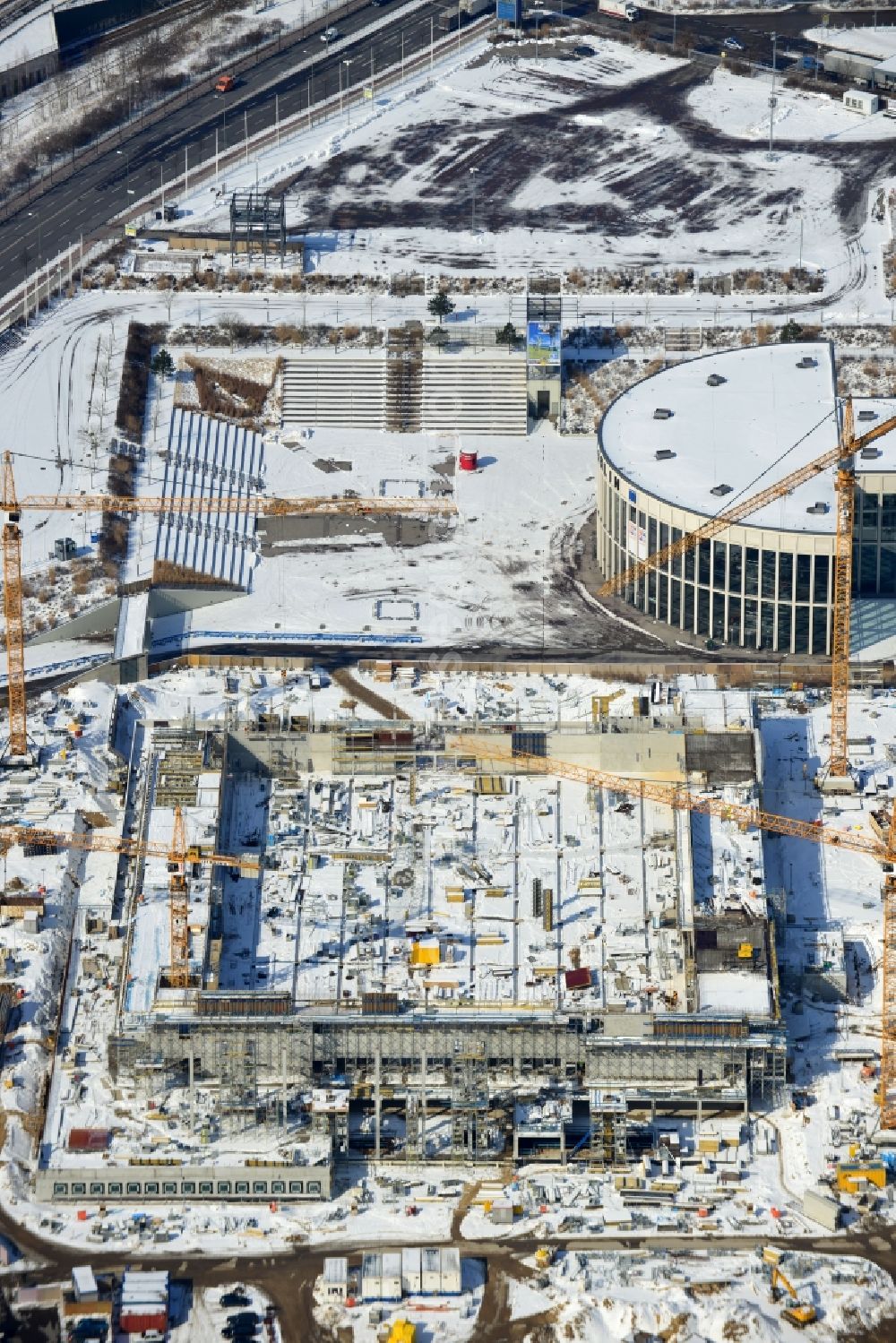 Berlin from the bird's eye view: View of construction site at the exhibition venue Cube City Exhibition Grounds in Berlin Charlottenburg. On the site of the demolished Germany Hall is to be completed by the end of 2013, designed by the architectural firm UNIQUE CODE suitable congress hall