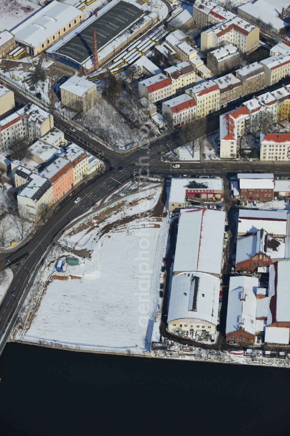 Berlin Schöneweide from the bird's eye view: Winter covered with snow industrial area in Berlin Schöneweide