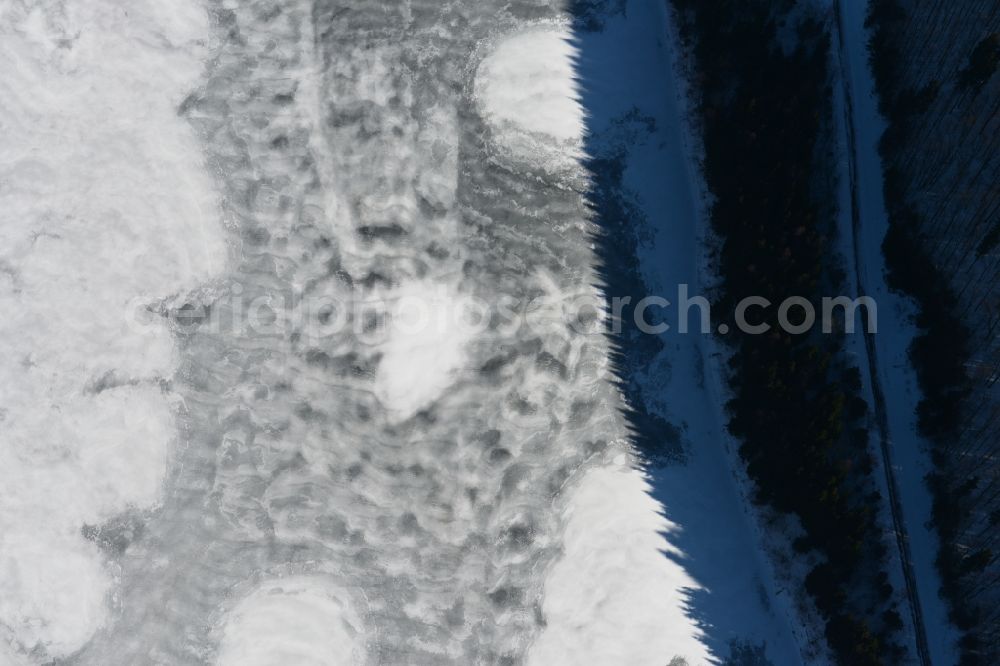 Schleusegrund from the bird's eye view: Wintry snow-covered landscape at the dam at Schleusengrund in Thuringia