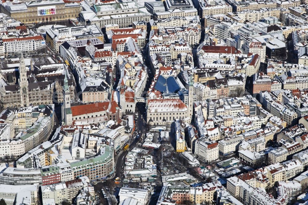 München from above - Winter with snow covered Viktualienmarkt in the historic center in Munich in Bavaria