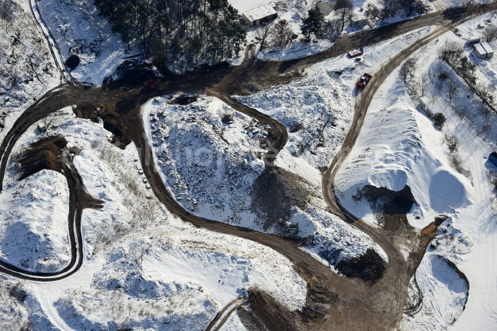 Aerial photograph Berlin - Wintry road covered with snow the recycling of building materials and soil treatment company in the cemetery road Berlin - Mahlsdorf