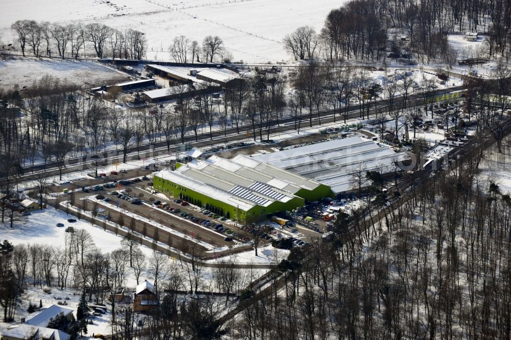 Aerial image Dahlwitz - Hoppegarten - Winter with snow covered grounds of the garden market in Dahlwitz - Hoppegarten in Brandenburg