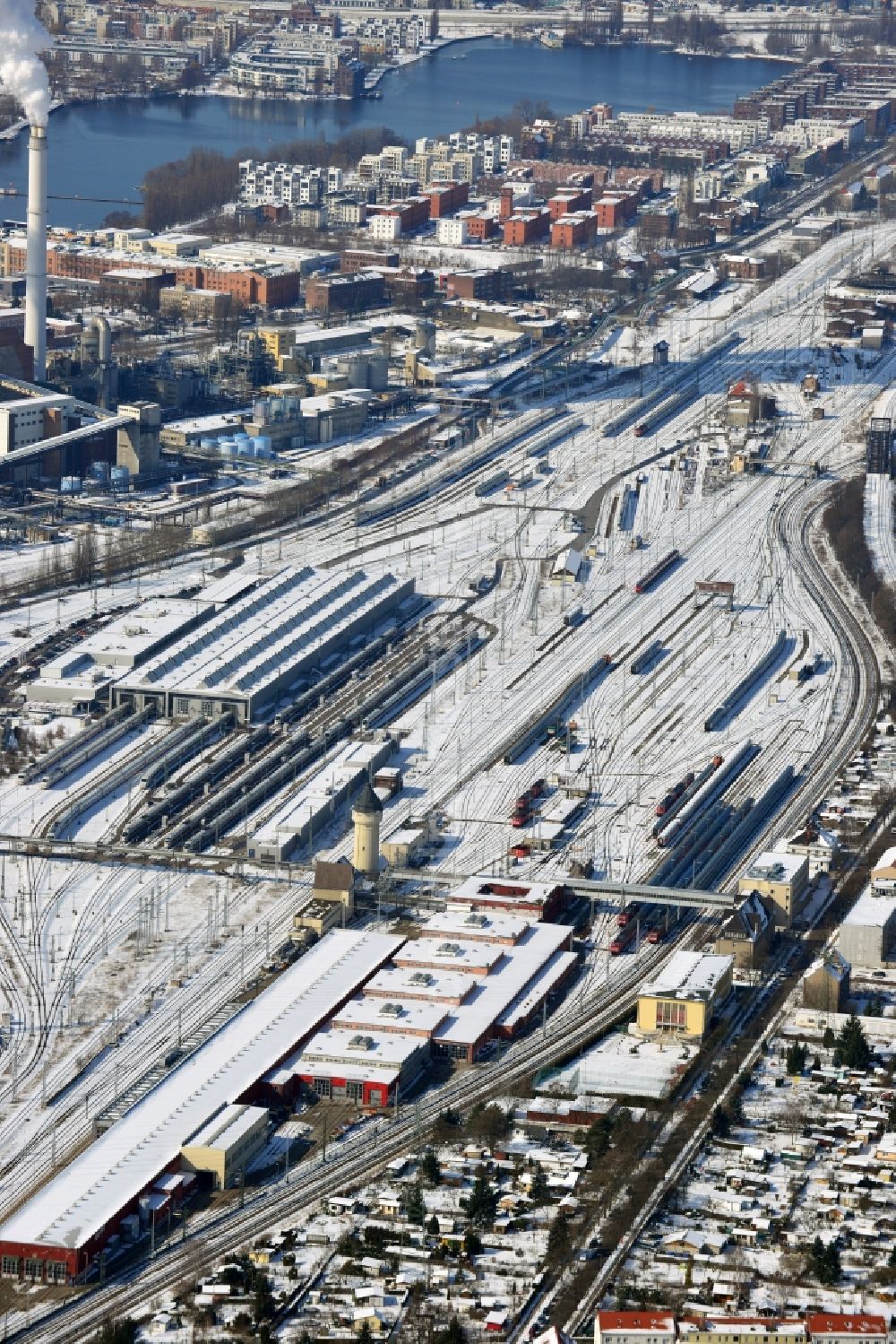 Berlin Schöneweide from above - Wintry road covered with snow and the marshalling station Rummelsburg operation of Deutsche Bahn in Berlin - Rummelsburg