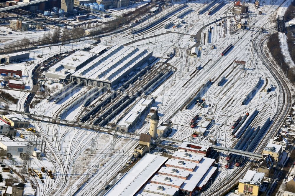 Berlin Schöneweide from the bird's eye view: Wintry road covered with snow and the marshalling station Rummelsburg operation of Deutsche Bahn in Berlin - Rummelsburg