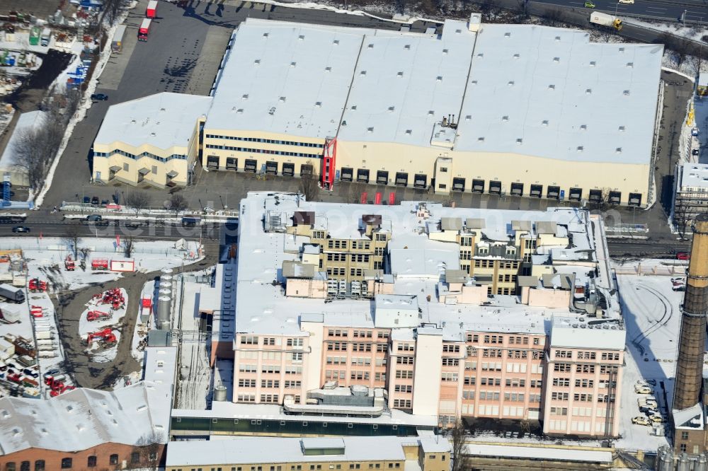 Berlin Tempelhof from the bird's eye view: Winter covered with snow industrial area in Berlin Tempelhof