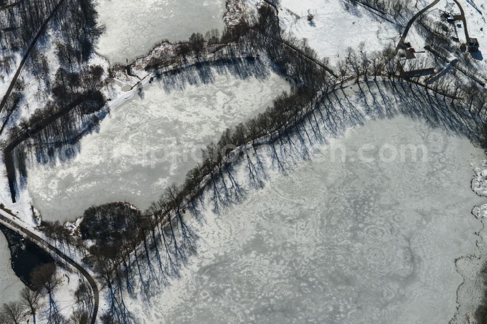 Ilmenau from above - Wintry provided with snow and ice surface of the lake Grosser Teich in Ilmenau in Thuringia