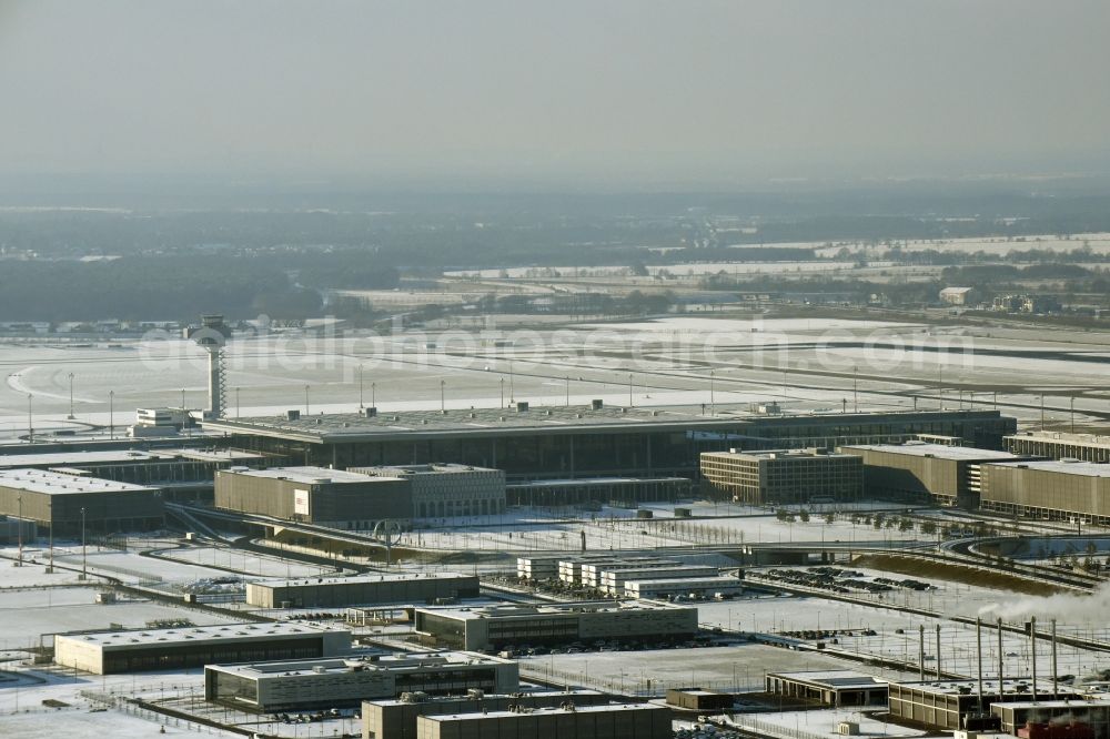 Aerial image Schönefeld - Wintry snowy dispatch building and terminals on the premises of the airport BER in Schoenefeld in the state Brandenburg