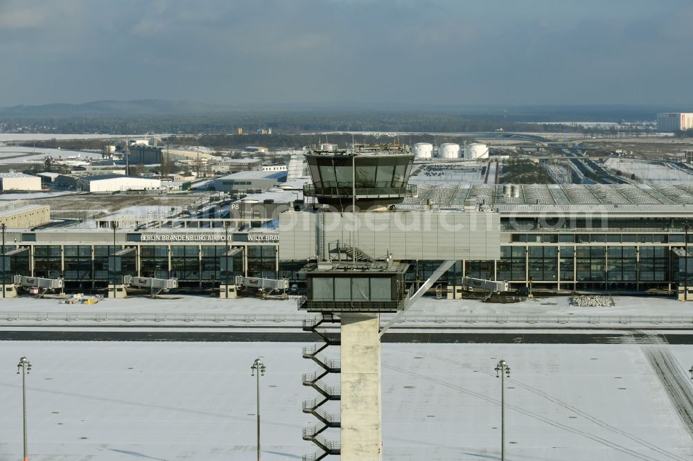 Schönefeld from above - Wintry snowy dispatch building and terminals on the premises of the airport BER in Schoenefeld in the state Brandenburg