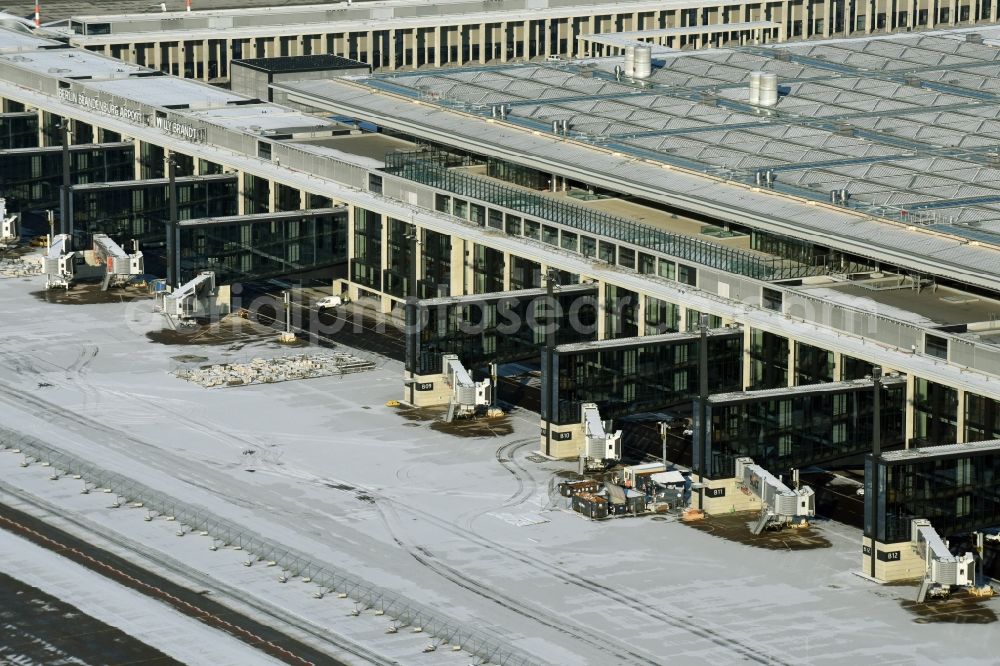 Aerial image Schönefeld - Wintry snowy dispatch building and terminals on the premises of the airport BER in Schoenefeld in the state Brandenburg