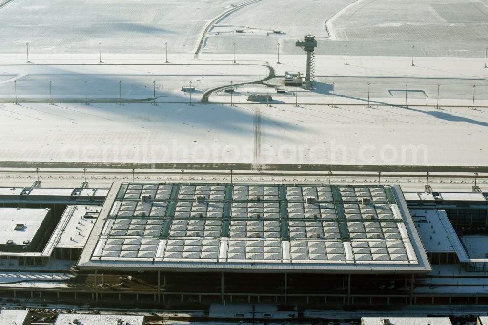 Aerial image Schönefeld - Wintry snowy dispatch building and terminals on the premises of the airport BER in Schoenefeld in the state Brandenburg