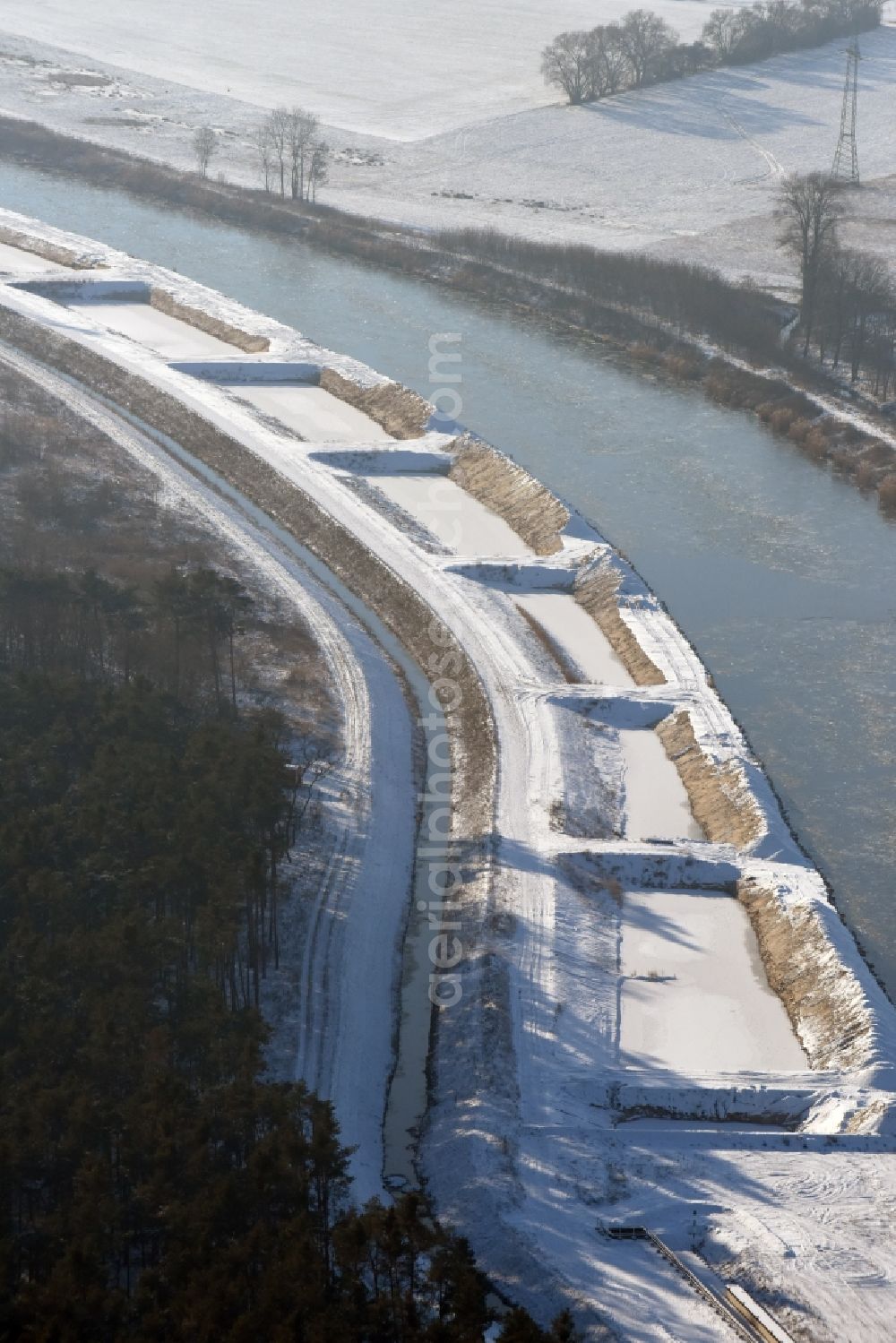 Aerial image Ihleburg - Wintry snowy disposal sites on the banks of the Elbe-Havel canal at Ihleburg in Saxony-Anhalt