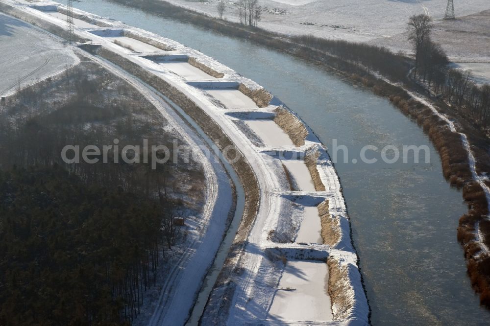 Aerial photograph Ihleburg - Wintry snowy disposal sites on the banks of the Elbe-Havel canal at Ihleburg in Saxony-Anhalt