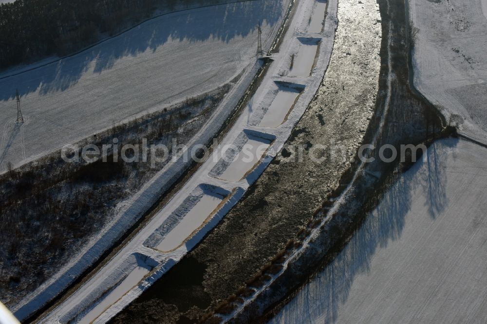 Aerial image Ihleburg - Wintry snowy disposal sites on the banks of the Elbe-Havel canal at Ihleburg in Saxony-Anhalt