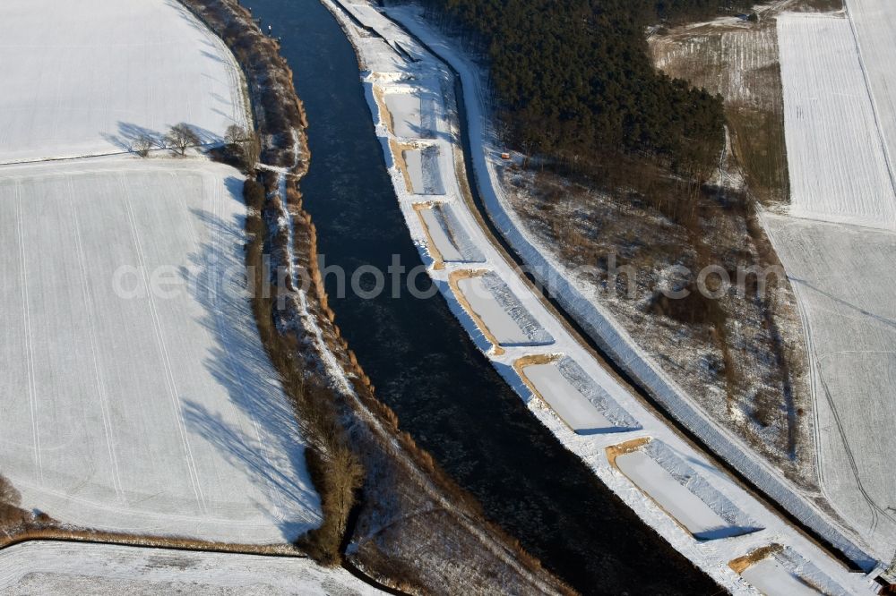 Ihleburg from the bird's eye view: Wintry snowy disposal sites on the banks of the Elbe-Havel canal at Ihleburg in Saxony-Anhalt