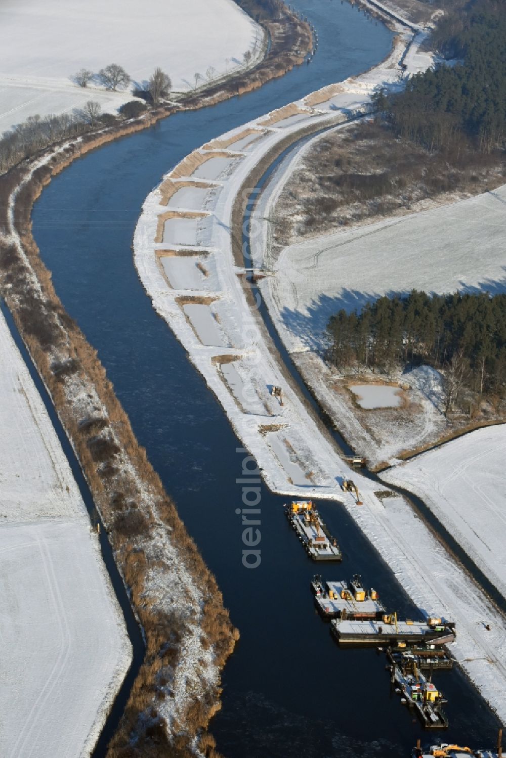 Ihleburg from above - Wintry snowy disposal sites on the banks of the Elbe-Havel canal at Ihleburg in Saxony-Anhalt