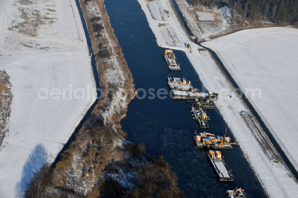 Ihleburg from the bird's eye view: Wintry snowy disposal sites on the banks of the Elbe-Havel canal at Ihleburg in Saxony-Anhalt