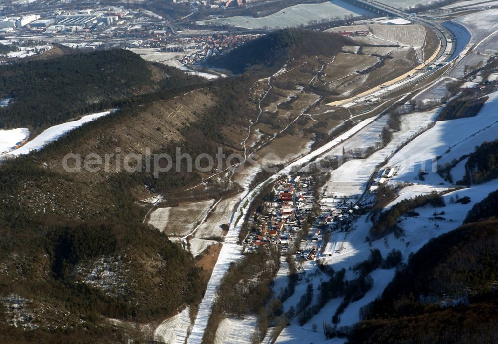 Aerial photograph Jena - Wintry snow-covered entry and exit of the Jagdberg Tunnel near Leutra in the state of Thuringia. The federal motorway A4 takes its course through the tunnel. Its former course is visible next to the tunnel