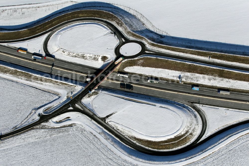 Aerial image Bucha - Snow covered highway exit and access of the federal motorway A4 in Bucha in the state of Thuringia