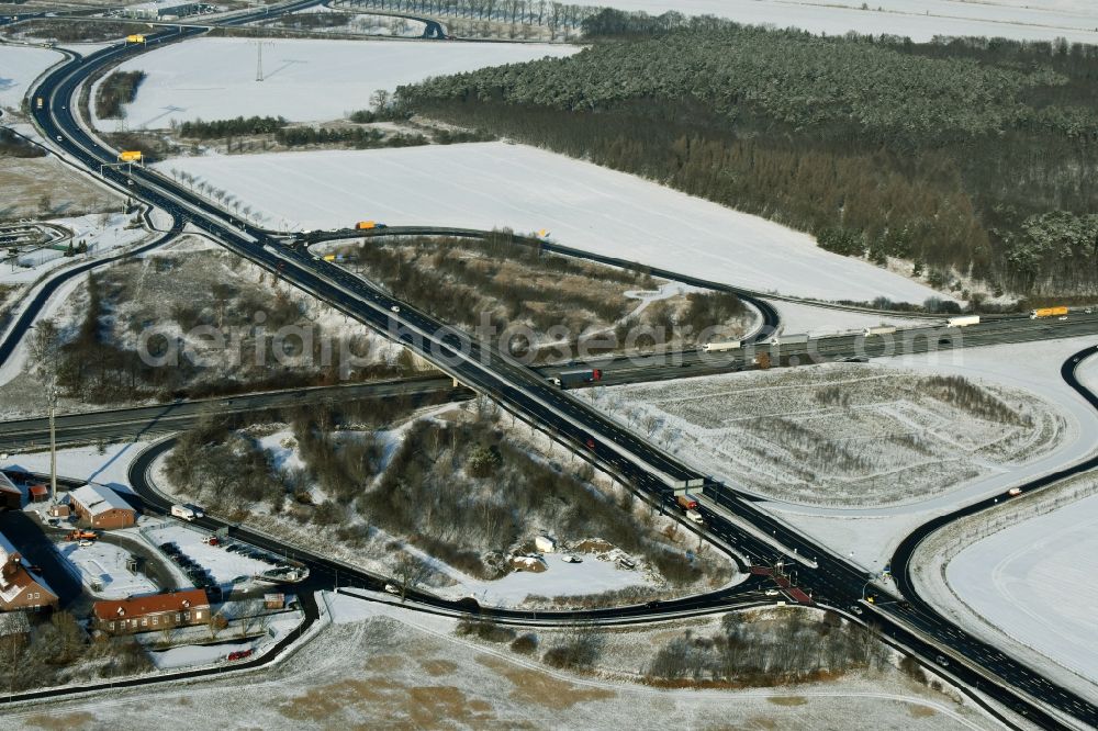 Aerial photograph Rangsdorf - Wintry snowy motorway exit Rangsdorf on the Berliner Ring motorway A10 - E30 in Rangsdorf in Brandenburg