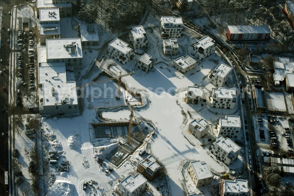 Berlin from above - Wintry snowy building construction residential complex Five morning Dahlem Urban Village of STOFANEL group in Berlin