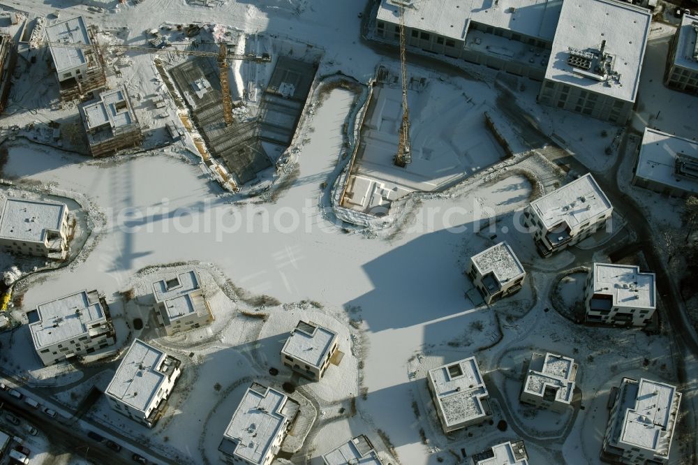 Berlin from above - Wintry snowy building construction residential complex Five morning Dahlem Urban Village of STOFANEL group in Berlin