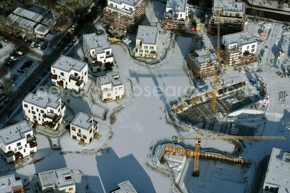 Berlin from above - Wintry snowy building construction residential complex Five morning Dahlem Urban Village of STOFANEL group in Berlin