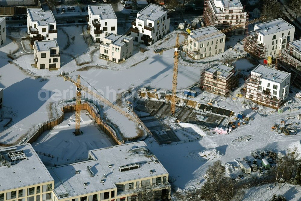 Berlin from above - Wintry snowy building construction residential complex Five morning Dahlem Urban Village of STOFANEL group in Berlin