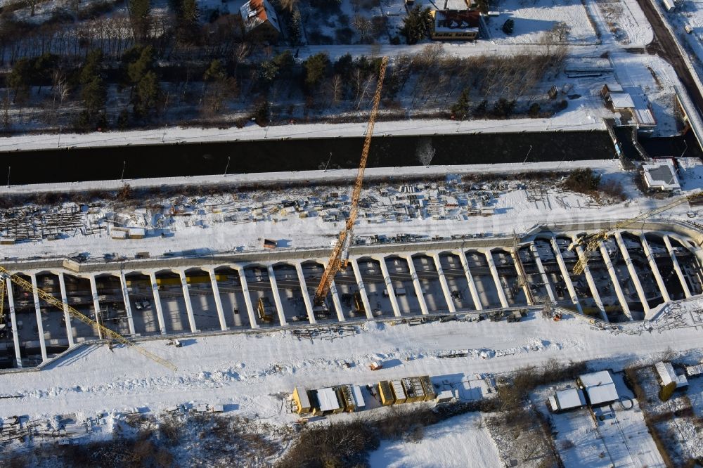 Aerial photograph Zerben - Wintry snowy construction site at the Zerben sluice, bridge and the riverside of the Elbe-Havel-Canel in the state Saxony-Anhalt