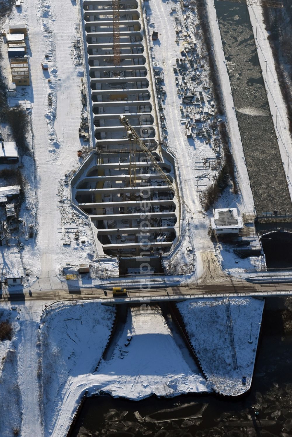 Zerben from above - Wintry snowy construction site at the Zerben sluice, bridge and the riverside of the Elbe-Havel-Canel in the state Saxony-Anhalt