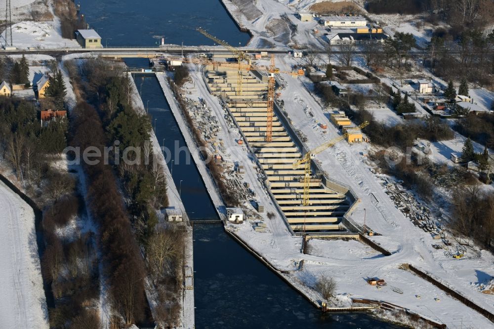 Zerben from above - Wintry snowy construction site at the Zerben sluice, bridge and the riverside of the Elbe-Havel-Canel in the state Saxony-Anhalt