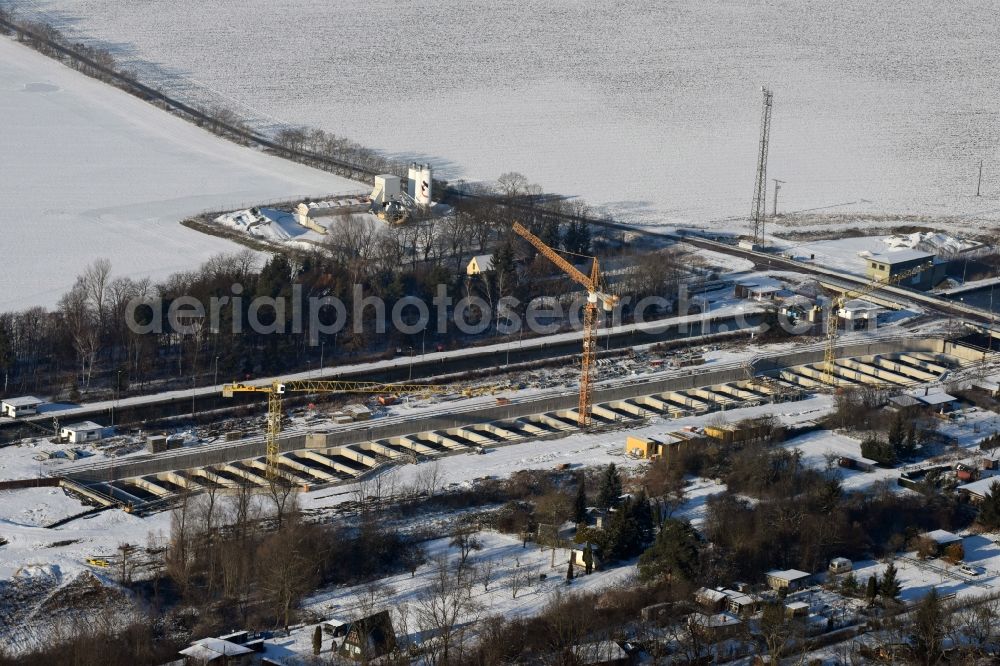 Aerial photograph Zerben - Wintry snowy construction site at the Zerben sluice, bridge and the riverside of the Elbe-Havel-Canel in the state Saxony-Anhalt