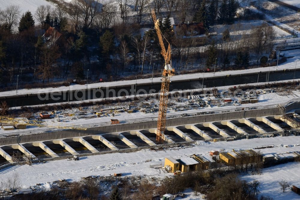 Zerben from above - Wintry snowy construction site at the Zerben sluice, bridge and the riverside of the Elbe-Havel-Canel in the state Saxony-Anhalt