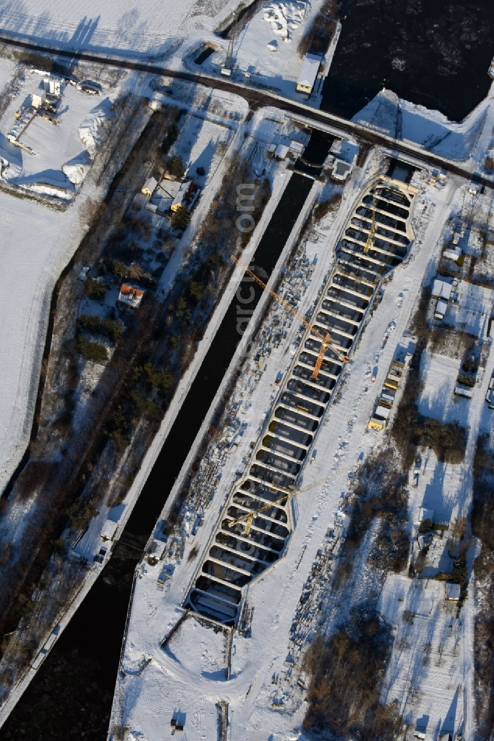 Zerben from above - Wintry snowy construction site at the Zerben sluice, bridge and the riverside of the Elbe-Havel-Canel in the state Saxony-Anhalt