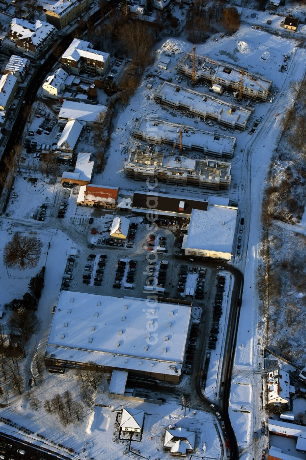 Aerial photograph Berlin - Wintry snowy construction site to build a new multi-family residential complex An der Schule destrict Mahlsdorf in Berlin