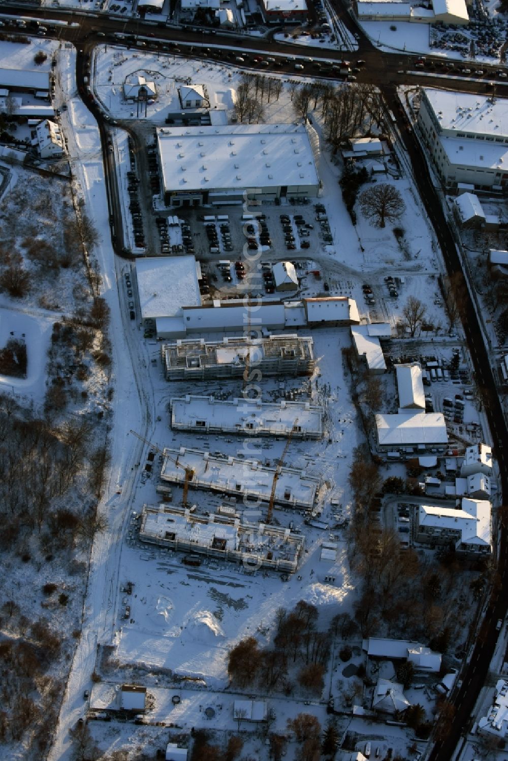 Aerial photograph Berlin - Wintry snowy construction site to build a new multi-family residential complex An der Schule destrict Mahlsdorf in Berlin