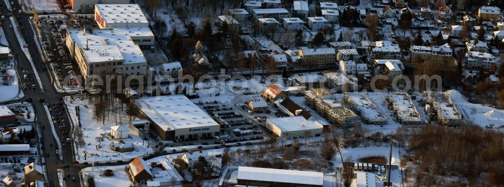 Aerial photograph Berlin - Wintry snowy construction site to build a new multi-family residential complex An der Schule destrict Mahlsdorf in Berlin