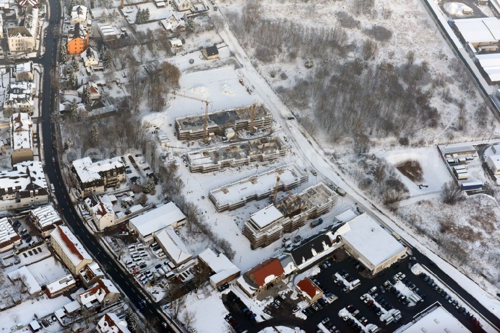 Aerial photograph Berlin - Wintry snowy construction site to build a new multi-family residential complex An der Schule destrict Mahlsdorf in Berlin