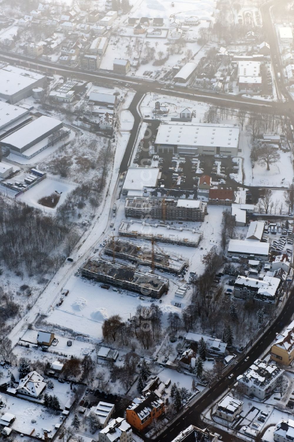 Aerial image Berlin - Wintry snowy construction site to build a new multi-family residential complex An der Schule destrict Mahlsdorf in Berlin