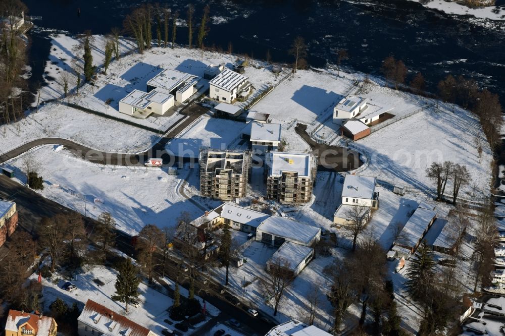 Brandenburg an der Havel from above - Winterly snowy construction site to build a new multi-family residential complex in Brandenburg an der Havel in the state Brandenburg