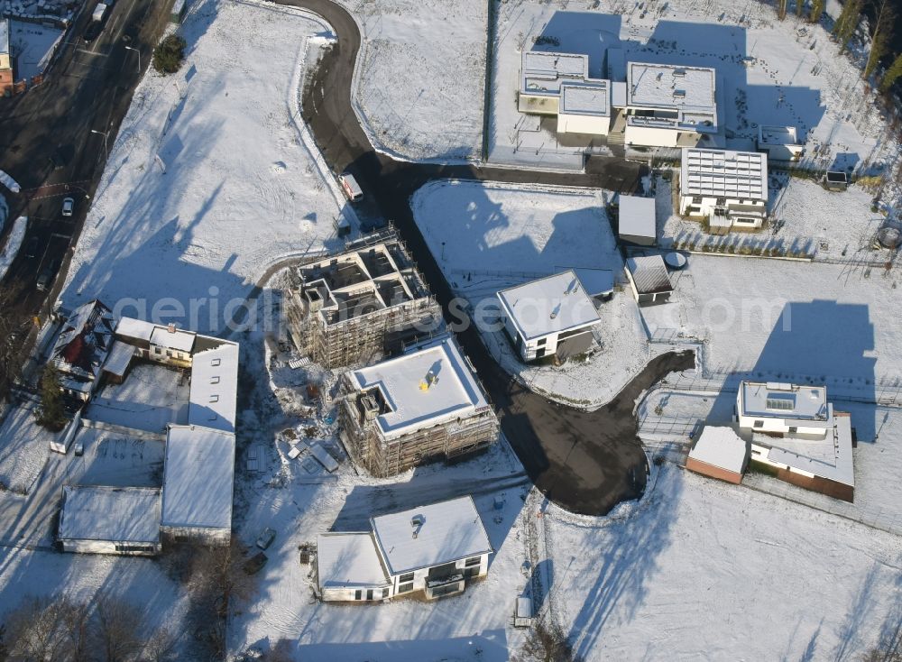 Brandenburg an der Havel from the bird's eye view: Winterly snowy construction site to build a new multi-family residential complex in Brandenburg an der Havel in the state Brandenburg